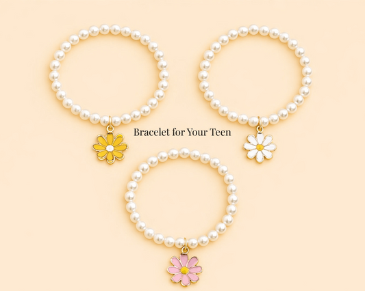 Three pearl bracelets with flower charms on a beige background